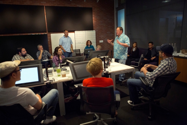 Director John Lasseter works with members of his story team on Disney•Pixar's 